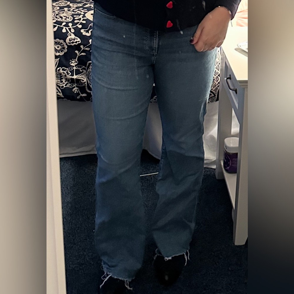 LOFT flair jeans with a distressed fringe ends